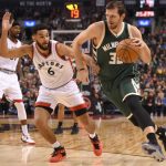 9744573-mirza-teletovic-cory-joseph-nba-milwaukee-bucks-toronto-raptors