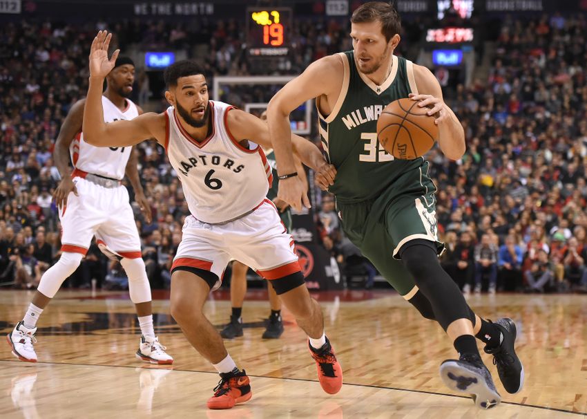 9744573-mirza-teletovic-cory-joseph-nba-milwaukee-bucks-toronto-raptors