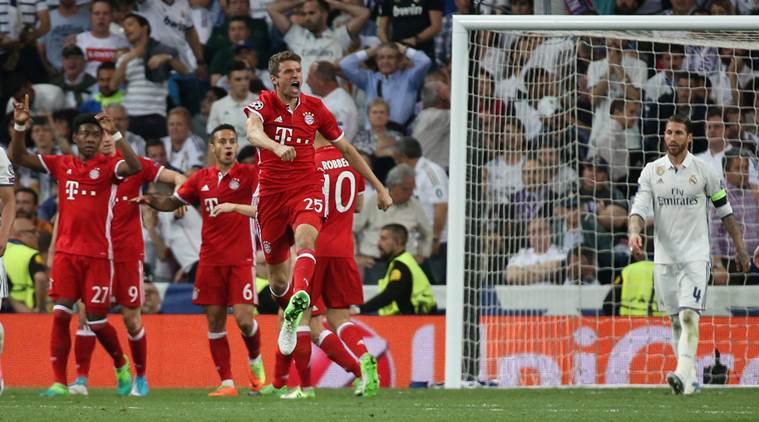 Bayern Munich's Thomas Muller celebrates after Real Madrid's Sergio Ramos scores an own goal and the second goal for Bayern Munich